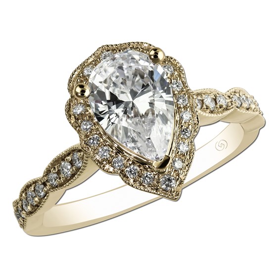 Yellow gold vintage engagement ring with pear shape diamond